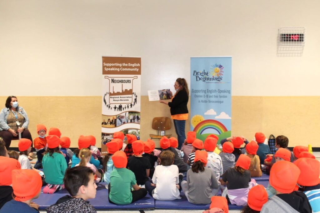 Large group of children sitting on the floor for story time for Bright Beginings event