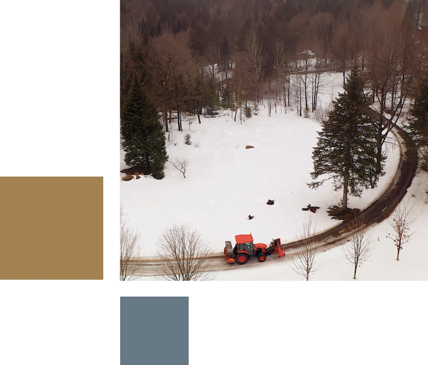 Overhead image of a snow removal vehicle driving down the road.